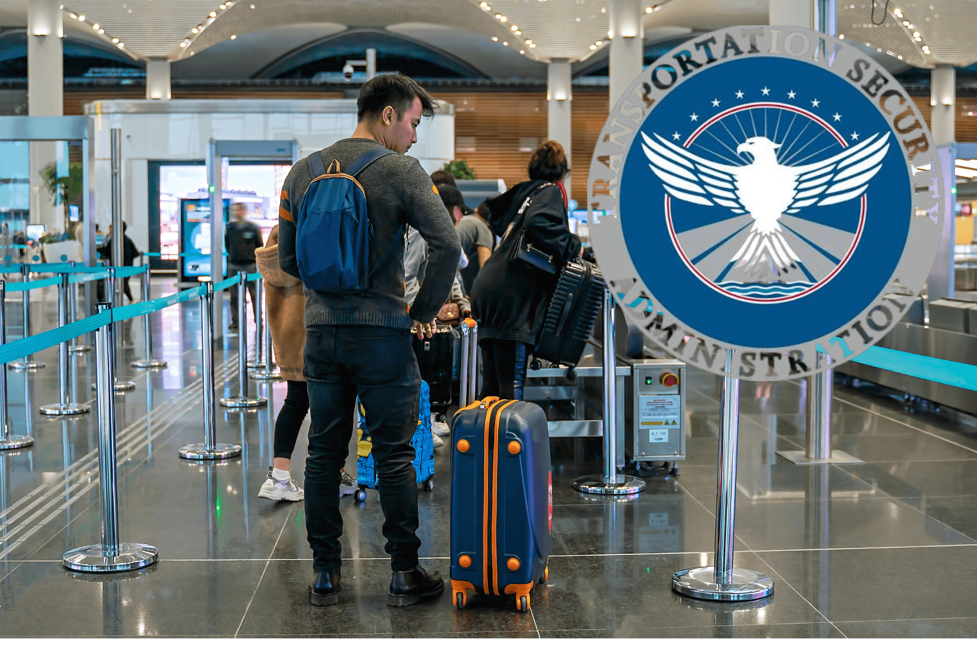A man standing in line with a suitcase