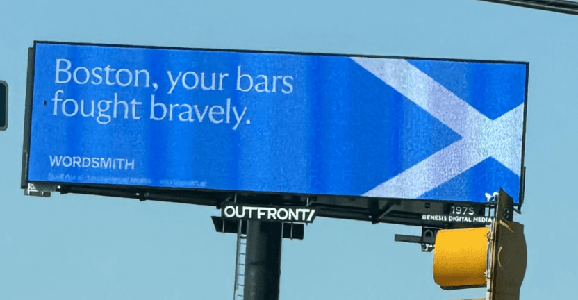 billboard with Scottish flag reading "Boston, your bars fought bravely."