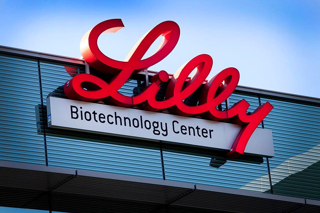 Lilly in red on top of biotechnology sign